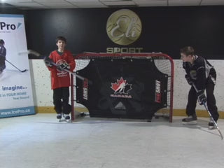 Load video: Synthetic ice surfaces allow coaches and instructors to run small-group hockey training sessions focused on skating, puck control, and skill development without relying on full ice.