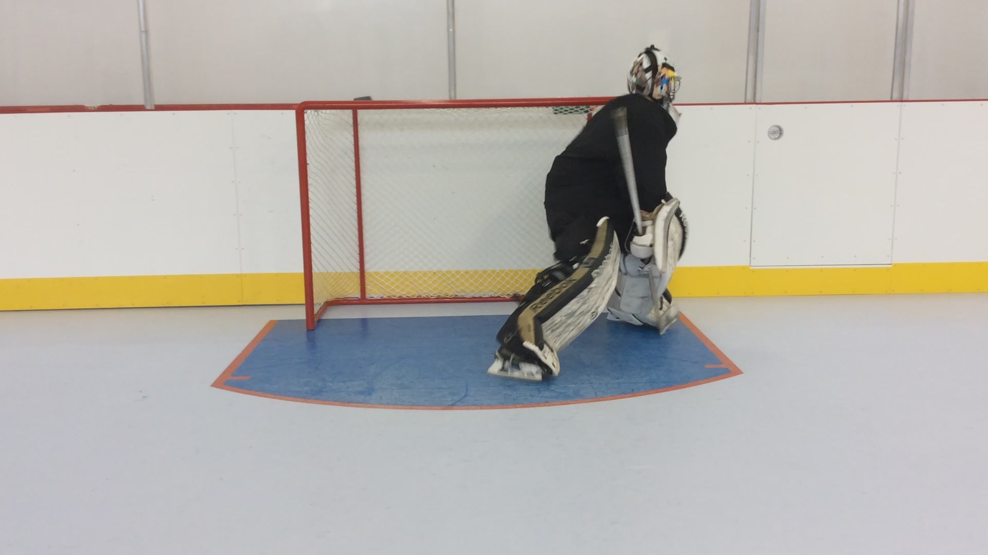 Load video: Performance-grade synthetic ice allows goalies to work on skating mechanics, crease movement, and recovery patterns while building confidence through repeat training reps.